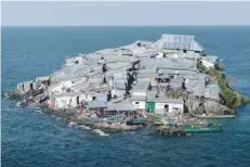  ?? — AFP ?? A general view of Migingo Island which is densely populated by residents fishing mainly for Nile perch in Lake Victoria on the border of Uganda and Kenya.