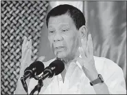  ?? AP/AARON FAVILA ?? Philippine President Rodrigo Duterte speaks at a ceremony with the Philippine­s military Tuesday at the presidenti­al palace in Manila, the same day he asked Congress to extend martial law in the country’s south.