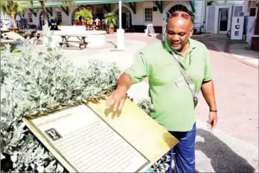  ?? WASHINGTON POST LINDA NELSON NASH FOR THE ?? During the January trip, Barbados guide Victor Cooke makes a point at a marker explaining future President George Washington’s seven-week stay – at 19 – which may have altered US history.