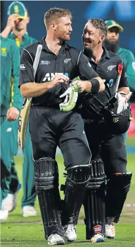  ?? /AFP ?? Black knight: New Zealand’s Martin Guptill, left, and Luke Ronchi leave the field well satisfied after the Black Caps beat SA in Hamilton on Wednesday.