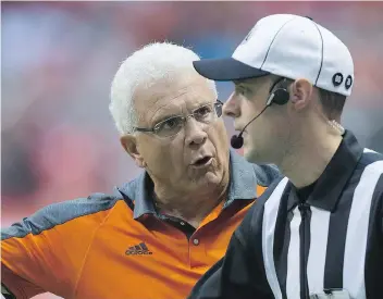  ?? THE CANADIAN PRESS ?? Lions head coach Wally Buono, seen here protesting a call to an official last week, is using the coach’s challenge a lot, just like his fellow CFL coaches. However, some calls are taking a long time to review.