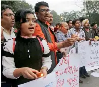  ?? — AP ?? Human rights activists hold placards during a protest in Kolkata against the brutal killing of a labourer in Rajasthan, on Friday.