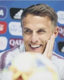  ??  ?? 0 England manager Phil Neville addresses the media.