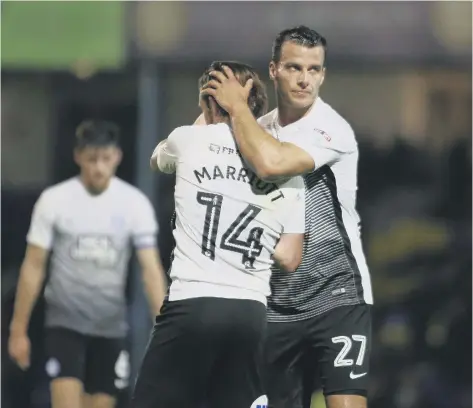  ??  ?? Steven Taylor congratula­tes Jack Marriott after his goal for Posh at Southend.