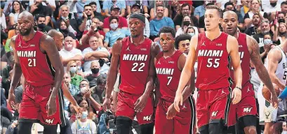  ?? ISSAC BALDIZON GETTY IMAGES ?? Dewayne Dedmon, Jimmy Butler, Kyle Lowry, Duncan Robinson, P.J. Tucker and the Heat dominated in their season opener.