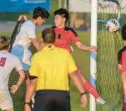  ?? DOUG KAPUSTIN/FOR BALTIMORE SUN MEDIA ?? Centennial senior Riley Sensi heads the ball past Glenelg defender Dylan Ma for the tying goal late in the first half Wednesday.