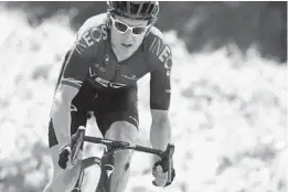  ?? CHRISTOPHE ENA/AP ?? Britain’s Geraint Thomas rides with the pack, his left knee bloodied from a crash, during the 16th stage of the Tour de France in Nimes, France, on Tuesday.