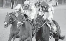  ?? JEFF ROBERSON/AP ?? John Velazquez, riding Medina Spirit, leads Florent Geroux on Mandaloun and Flavien Prat riding Hot Rod Charlie to win the 147th running of the Kentucky Derby on Saturday at Churchill Downs.