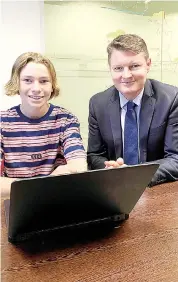  ??  ?? Damon Ingram from Warragul goes through the new online learner permit test when it was launched in Morwell last week by Roads and Road Safety Minister Ben Carroll (right).