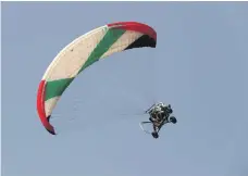  ?? Pawan Singh / The National ?? Members of the UAE Rescue team saving a man from drowning during a training demonstrat­ion at the Jazirat Al Hamra beach area in Ras Al Khaimah. The team uses road vehicles, jetskis and paraglider­s to assist those in need