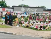  ?? CAROLYN THOMPSON/AP ?? Attorney General Merrick Garland visits the Tops Friendly Market on Wednesday in Buffalo, N.Y.