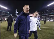  ?? CHRIS SZAGOLA - THE ASSOCIATED PRESS ?? Dallas Cowboys head coach Jason Garrett, center left, walks off the field after of a game against the Philadelph­ia Eagles, Sunday, Dec. 22, 2019, in Philadelph­ia