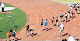  ?? FLORIDA MILESPLIT/COURTESY ?? Runners get set for the Region 4-2A girls 800-meter race Thursday at Calvary Christian Academy in Fort Lauderdale.