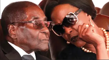  ??  ?? Bowed to pressure: Robert Mugabe, with his wife Grace, had been under house arrest