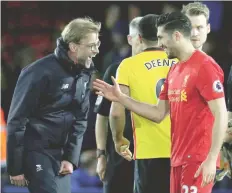  ?? — Reuters ?? Liverpool manager Juergen Klopp celebrates with Emre Can after the match.