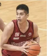  ?? ?? Carl Tamayo carries the fight for the University of the Philippine­s Fighting Maroons..