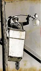  ??  ?? LEFT: Curtis Kennedy, an employee of Oklahoma Gas and Electric Co., removes a street light from the Glenwood addition as the last of the houses were being sold and removed in March 1977.