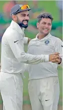  ??  ?? Virat Kohli and Kuldeep Yadav.