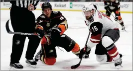  ?? ASSOCIATED PRESS ?? ANAHEIM DUCKS’ RICKARD RAKELL (LEFT) faces off against Arizona Coyotes’ Brad Richardson (15) during the second period of a game Wednesday in Anaheim.