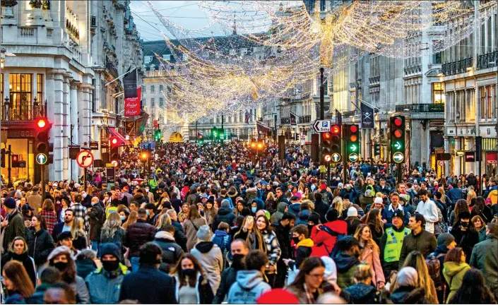  ??  ?? ROAD TO CHRISTMAS: Shoppers turned out in droves in London’s Regent Street which was pedestrian­ised yesterday for the first of three Traffic Free Saturdays in December to lure customers back