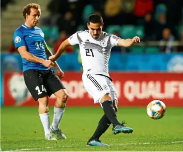  ?? — Reuters ?? The hero: Germany’s Ilkay Gundogan shoots at goal during the Euro 2020 Group C qualifying match against Estonia in Tallinn, Estonia, on Sunday.