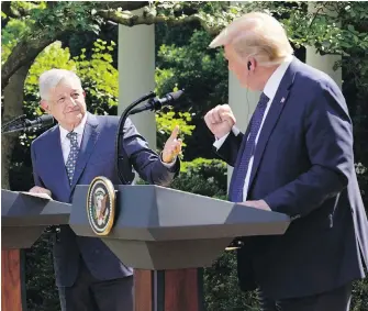  ?? EVAN VUCCI, THE ASSOCIATED PRESS ?? U.S. President Donald Trump and Mexican President Andres Manuel Lopez Obrador gesture before signing a joint trade declaratio­n at the White House, Wednesday in Washington.