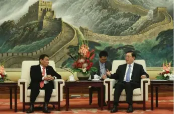  ?? WU HONG-POOL/GETTY IMAGES ?? Philippine President Rodrigo Duterte, left, and Zhang Dejiang, Chairman of the Standing Committee of the National People’s Congress of China, hold a meeting at the Great Hall of the People in Beijing.