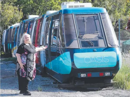  ?? Picture: MIKE BATTERHAM ?? Helen O'Boyle with some of the carriages of the old Broadbeach monorail she bought and is now selling.