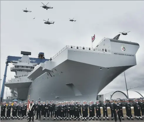  ??  ?? The launch of the new aircraft carrier Queen Elizabeth takes place against a background of disquiet in the Armed Forces over defence cuts.