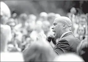  ?? AP/ ANDREW HARNIK ?? Sen. Cory Booker, D- N. J., speaks Tuesday at a rally of health care advocates, grass- roots activists and others outside the Capitol in Washington, where he called for the protection of the current health care law.