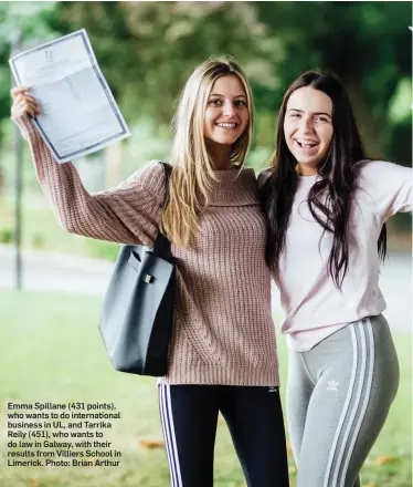  ??  ?? Emma Spillane (431 points), who wants to do internatio­nal business in UL, and Tarrika Reily (451), who wants to do law in Galway, with their results from Villiers School in Limerick. Photo: Brian Arthur