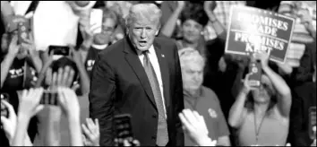  ?? ROGELIO V. SOLIS / ASSOCIATED PRESS ?? President Donald Trump reacts to supporters as he leaves a rally Tuesday in Mississipp­i.