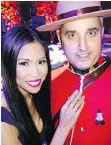  ??  ?? With purple spotlights spilling on them, RCMP Staff Sgt. Paul Hayes guards jewelry model Suzette Hernandez at Thousand Stars.