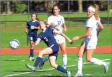  ?? GREGG SLABODA — TRENTONIAN PHOTO ?? Nottingham’s Emily Midura (3) boots the ball against Princeton.