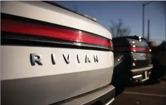  ?? YUKI IWAMURA — BLOOMBERG ?? Irvine-based Rivian Automotive said late Wednesday that it will reduce its salaried workforce by about 10%, its third paring in the last year and a half, because sales remain stagnant.