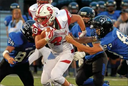  ?? BOB RAINES — DIGITAL FIRST MEDIA ?? Souderton’s Jeremy Tammaro tries to pull away from the Quakertown defense Friday night.