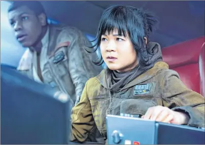  ?? AP PHOTO ?? This image released by Lucasfilm shows Kelly Marie Tran as Rose and John Boyega as Finn, left, in “Star Wars: The Last Jedi,” in theatres on Dec. 15.
