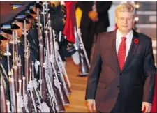  ?? CHERYL RAVELO/ REUTERS ?? PM Stephen Harper, reviewing troops in Manila on Friday, has edged toward the middle, unlike U.S. conservati­ves who have courted division.