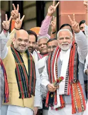  ?? — PTI ?? Prime Minister Narendra Modi along with BJP president Amit Shah and other party leaders at Parliament in New Delhi on Monday.