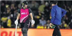  ?? PHOTO: GETTY IMAGES ?? How can that be? New Zealand batsman Sophie Devine shows her frustratio­n to the umpire after being given out by the third umpire during the first twenty20 internatio­nal against Australia in Sydney on Saturday.