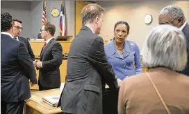  ?? RALPH BARRERA / AMERICAN-STATESMAN ?? Attorney Shaun Clarke (center) talks with his client, state Rep. Dawnna Dukes, after District Judge Brad Urrutia granted the prosecutio­n a continuanc­e in Dukes’ criminal case on Sept. 26.