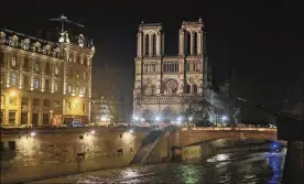  ?? MICHEL EULER / ASSOCIATED PRESS ?? The Notre Dame Cathedral has been newly illuminate­d last month since the April fire in 2019.