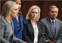  ?? Zach Gibson / Bloomberg ?? Sen. Kirsten Gillibrand, center, was the first to call for Sen. Al Franken’s resignatio­n on Wednesday. At least seven female U.S. senators want Franken to step down.