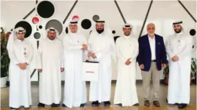  ??  ?? Ooredoo and Abdullah Al-Nouri Charity Associatio­n members in a group photo.