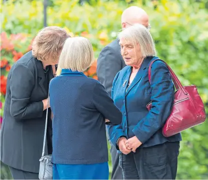  ?? Pictures: Steve MacDougall. ?? Mr Smith’s daughter Irene Noble at the funeral. Top right: The order of service showing Mr Smith and his wife Isobel. Above right: The Rev Marc Bircham, who knew Mr Smith for 20 years, paid tribute at the funeral service.