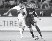  ?? Katharine Lotze Getty Images ?? GIANCARLO GONZALEZ, left, has returned to MLS after playing in Italy and likes the parity.