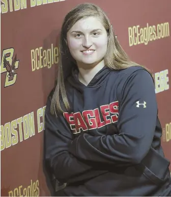  ?? STAFF PHOTO BY NICOLAUS CZARNECKI ?? TAKING THE NEXT STEP: Boston College’s Katie Burt, the winningest goalie in NCAA history, signed a contact last night to play profession­al hockey with the Boston Pride.