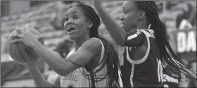  ?? NWA Democrat-Gazette/ANDY SHUPE ?? Fayettevil­le guard Coriah Beck (left) makes a move around Jonesboro forward Destiny Salary on Friday at Bulldog Arena in Fayettevil­le.