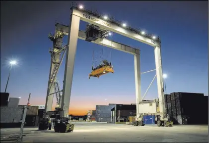  ?? Stephen B. Morton The Associated Press ?? A gantry moves into position Jan. 30 to transfer shipping containers at the Port of Savannah in Georgia. The United States is scheduled to slap tariffs on $200 billion of Chinese imports Monday.