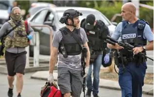  ??  ?? Officers from the New Zealand Armed Offenders Squad after the shooting in Chirstchur­ch, New Zealand on March 15, 2019.